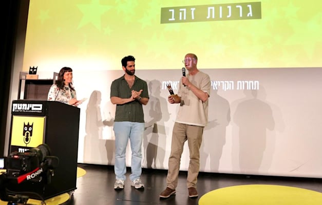 ניר רפואה מפייבר ואור בוטבול המנחה בתחרות הפרסום גרנות / צילום: אלון גלבוע