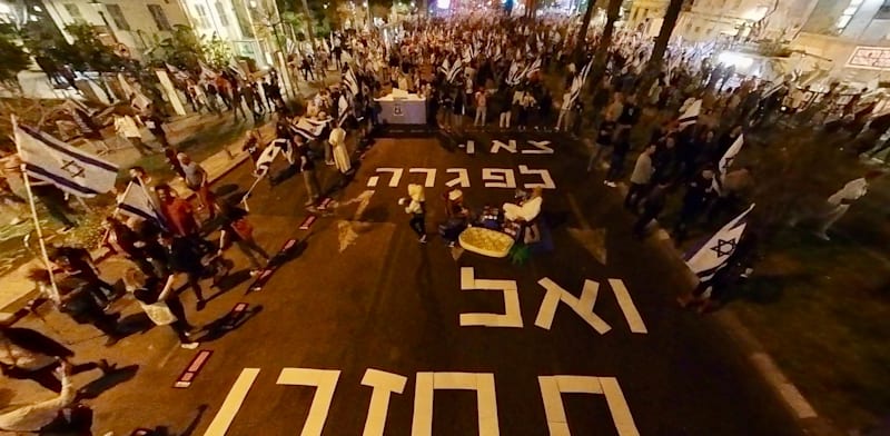 Demonstrators at Kaplan Street in Tel Aviv call for elections. The writing on the road reads ''Go into recess and don't come back''   credit: @sha_b_p