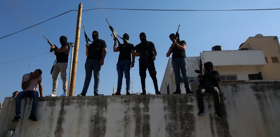 חמושים פלסטינים ברחובות ג'נין / צילום: Associated Press, Majdi Mohammed