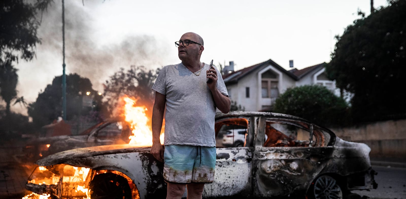 מכונית עולה באש במהומות בלוד, אמש / צילום: Reuters, Heidi Levine