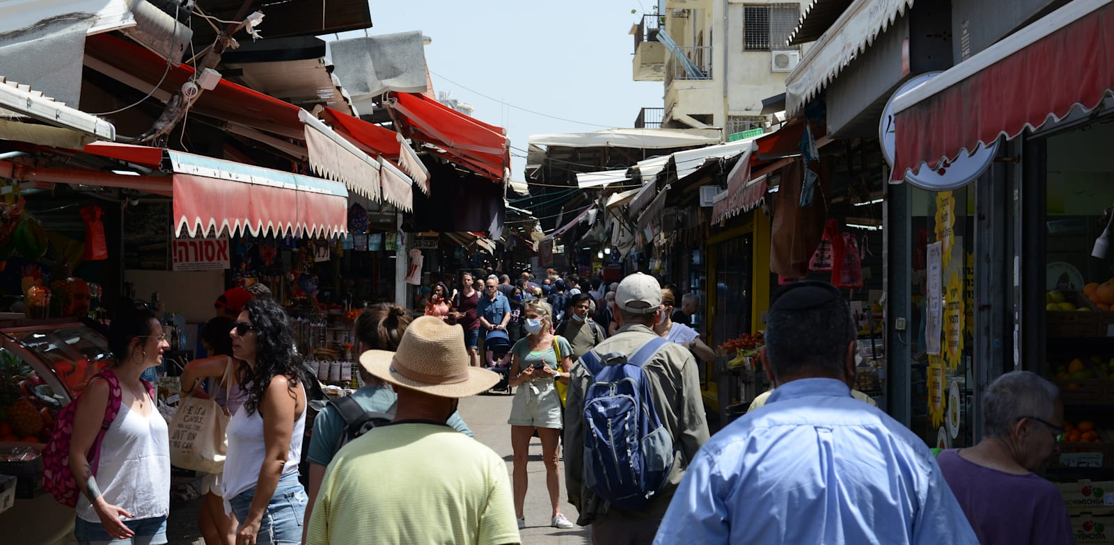 שוק הכרמל, תל אביב. נתוני הצמיחה בישראל מתעדכנים לרעה / צילום: איל יצהר