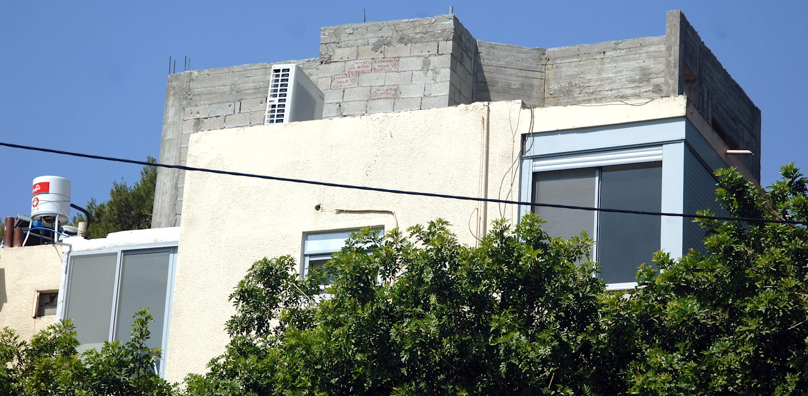 דירת גג. רק פיר המעלית היה חלק מהרכוש המשותף / צילום: פאול אורלייב