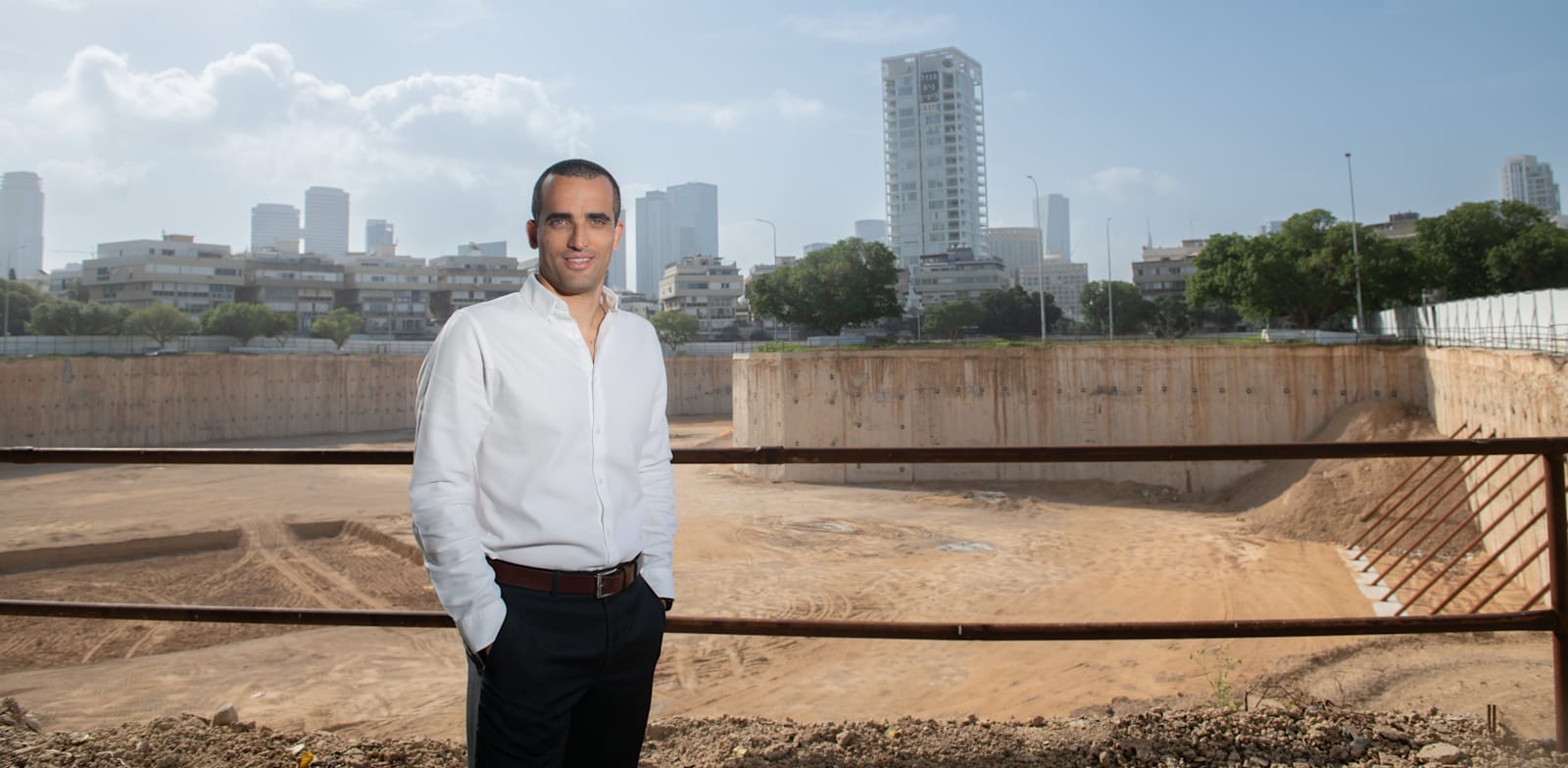 Adi Gazit with Kikar Hamedina project in background  credit: Gadi Sierra