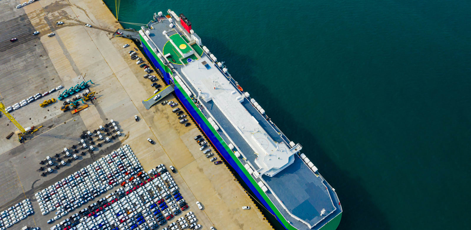 New vehicles about to be loaded on ship in Port of Shanghai credit: Shutterstock