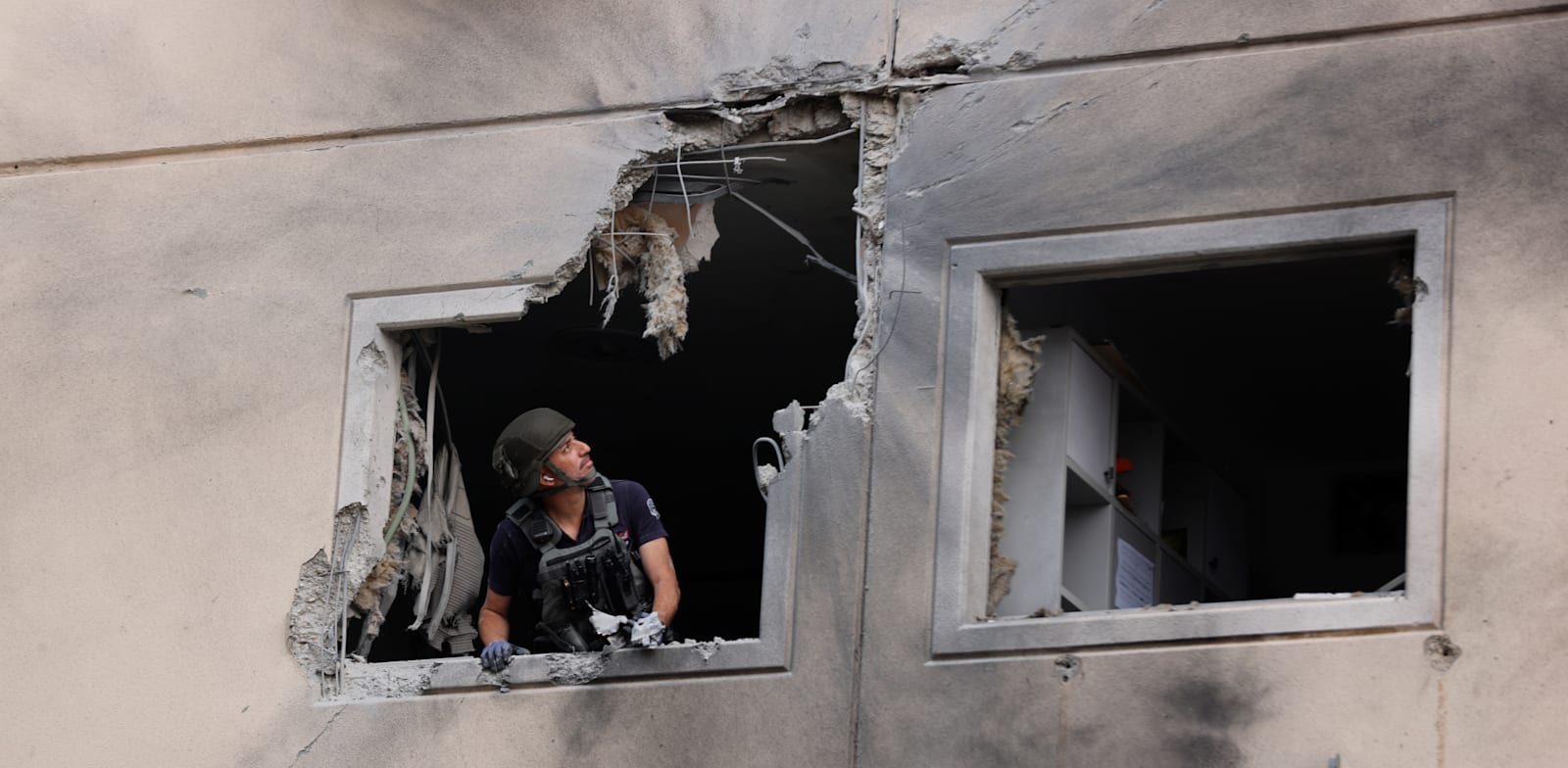 פגיעה בבניין באשקלון / צילום: Reuters, Amir Cohen