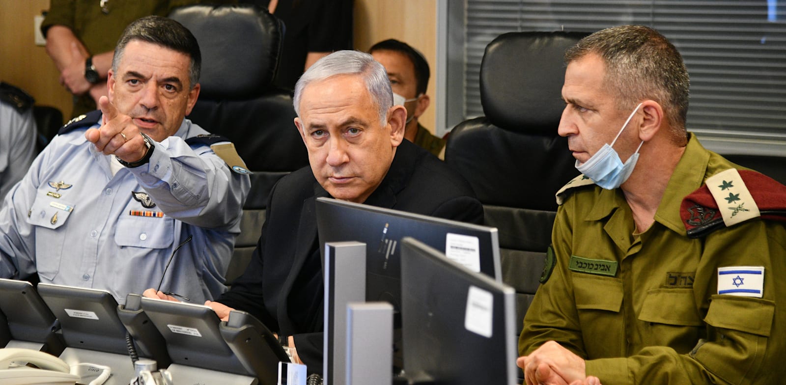 Prime Minister Benjmain Netanyhau with the Chief of Staff and the Israel Air Fore Commander at military HQ in Tel Aviv  credit:  Haim Zach, GPO