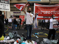 סוחרים בדרך יפו בת"א מוחים על סגירת המסחר בשל הקורונה / צילום: כדיה לוי