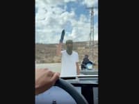 רעול פנים באזור שבו מתנחלים תקפו פלסטינים ודיפלומטיים באיו''ש / צילום: ap, Amit Orfali, IMAGE MADE FROM VIDEO