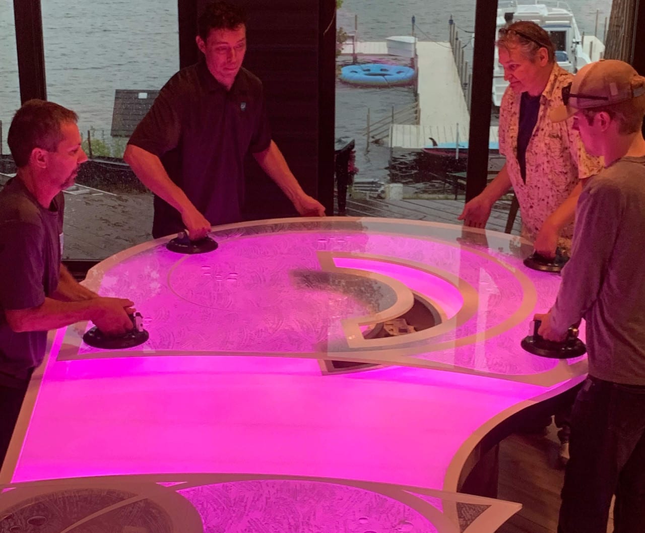 Frosted Glass being lifted over an evenly backlit surface to create a backlit glass countertop