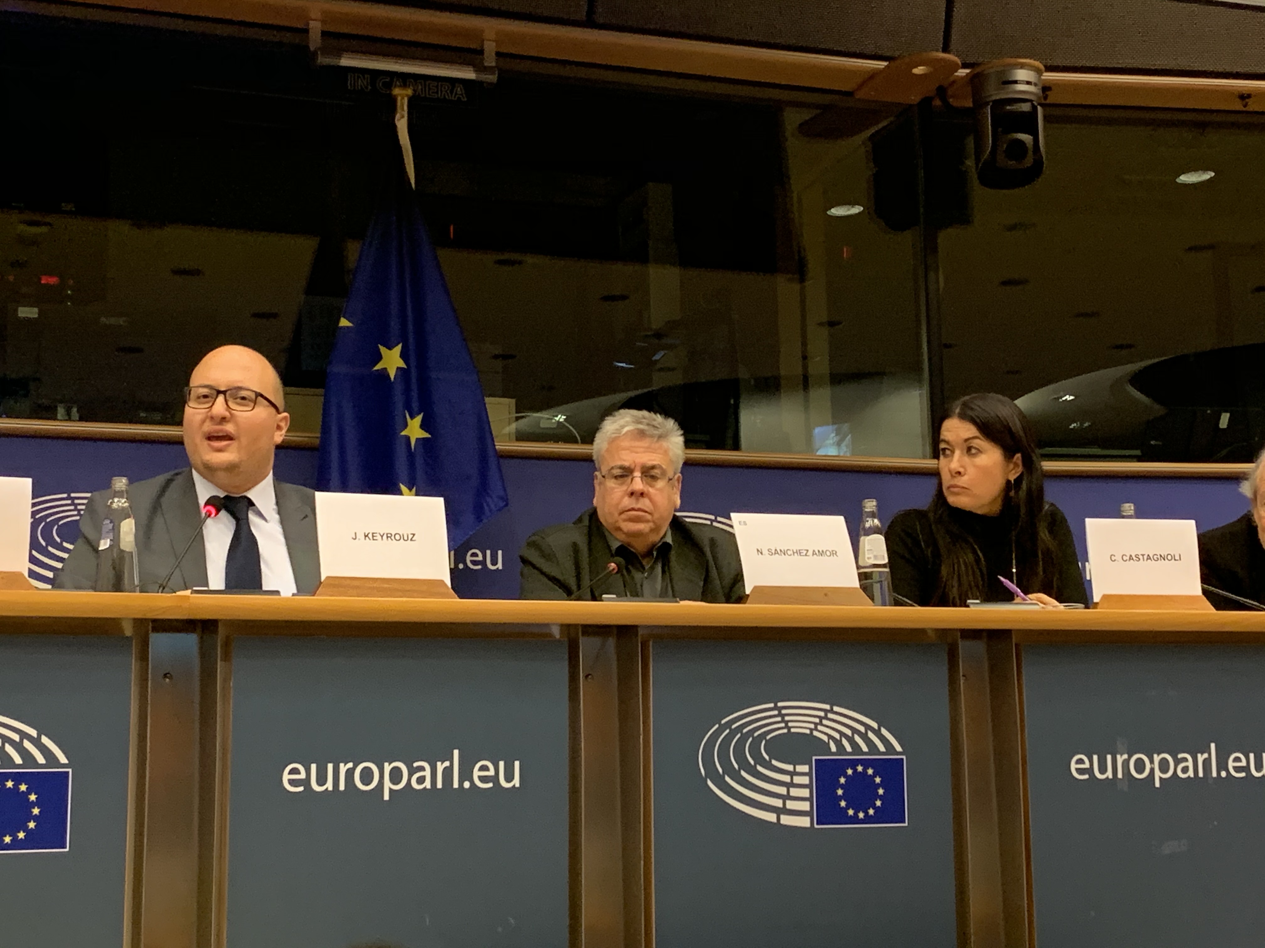 GNDEM Coordinating Committees Chair, gives remarks at panel at the EU Parliament. To the right, MEP Nacho Sánchez Amor and Cristina Castagnoli from the EU Parliament.