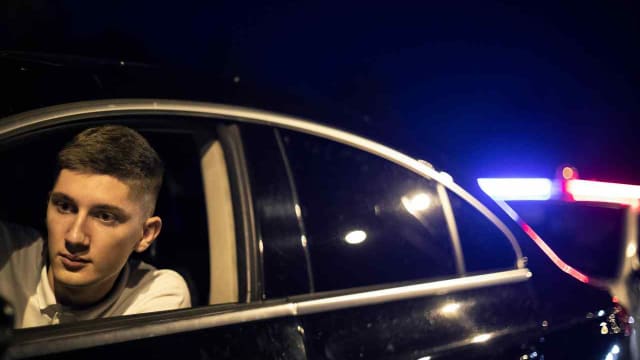 a young man being pulled over by the police
