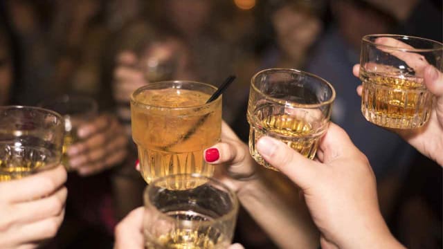a group of young people drinking