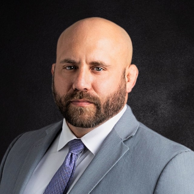 Jarrett Roman touma law member