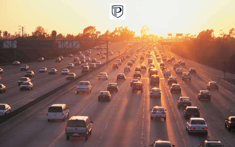 a highway in the late afternoon with moderate traffic