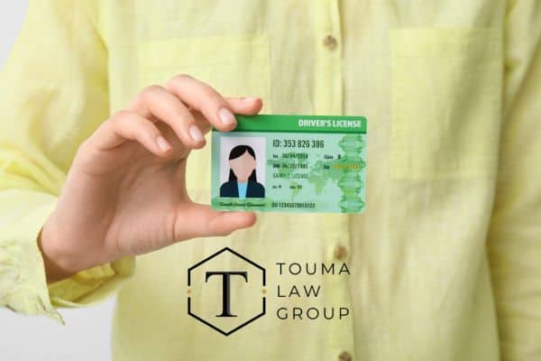 someone holding their driver's license, drivers' license reinstatement