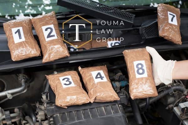 a large amount of drugs being trafficked in the hood of a car, drug trafficking charges in South Carolina