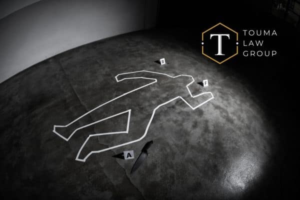 an outline of a person at a crime scene whose been murdered