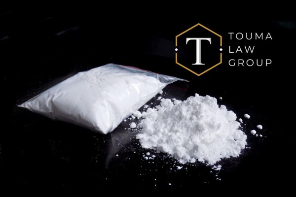 a bag of cocaine on a black desk