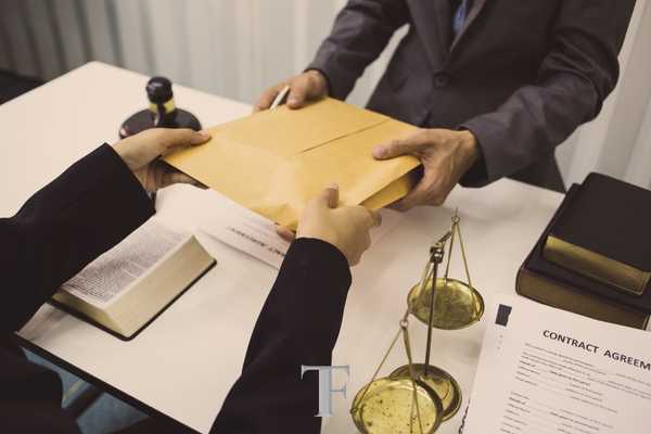 an evidence form on a table with a magnifying glass over it