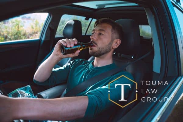 a man who has had too much to drink with his car keys in his hand