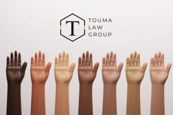 hands being held up that show different shades of skin color