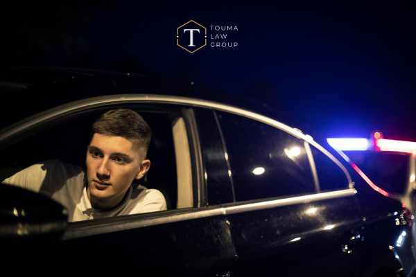 a young man in his car pulled over for suspicion of DUI