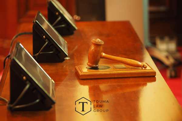 a gavel and touch screens in a court room