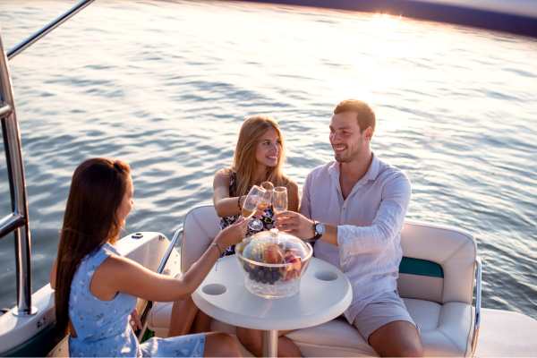 a group of people drinking on a boat