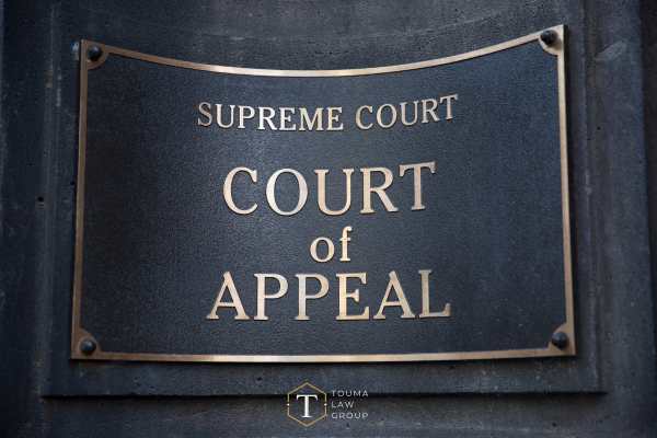 a picture of a plaque on a supreme court building