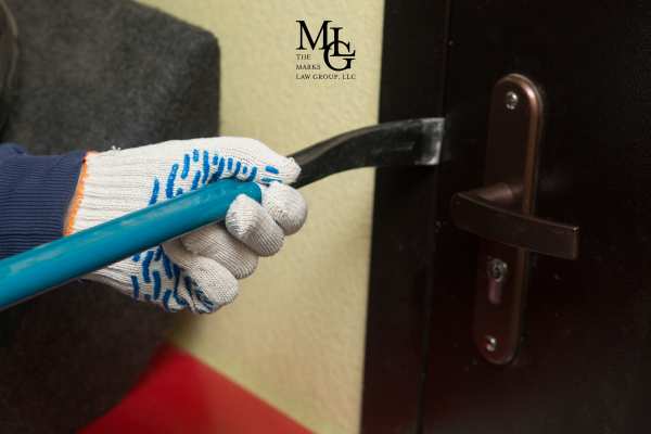 a man trying to break into an apartment