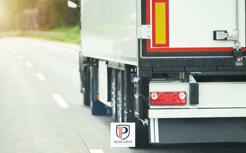 a commercial truck being driven down a road