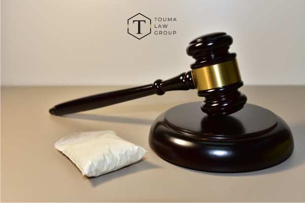 a gavel and bag of drugs on a desk