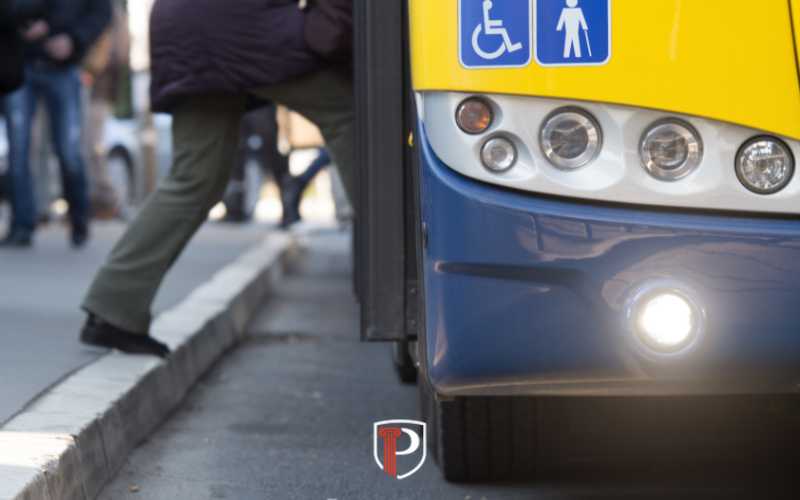a person with a suspended license getting on a bus