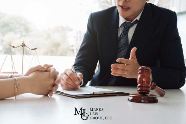 an attorney asking a woman questions during a depostion