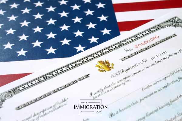 a naturalization certificate on an american flag