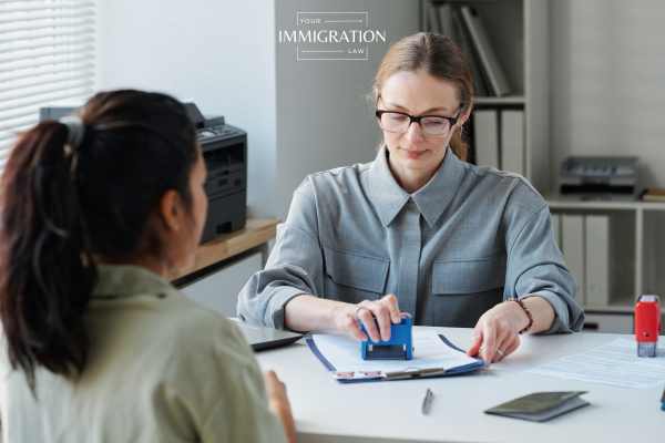 a woman getting approved for a visitor visa