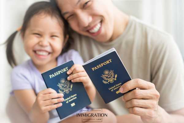 a father and daughter holding US passports
