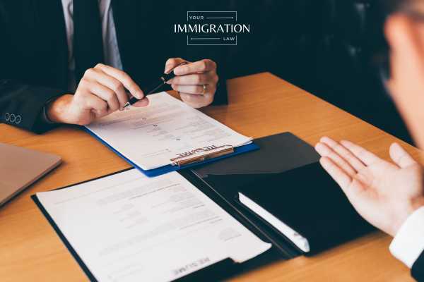 an l-1a visa holder meeting with a USCIS official