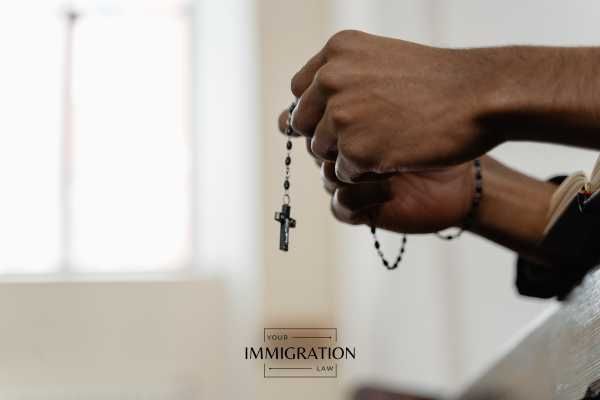 a man holding a rosary