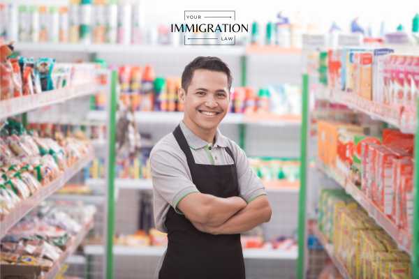 a young man with a student visa at work