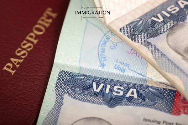 an eb 2 visa and passport on a table