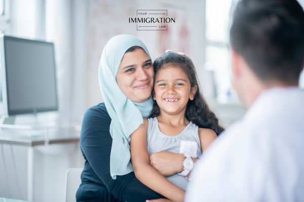a mother and daughter in a visa interview