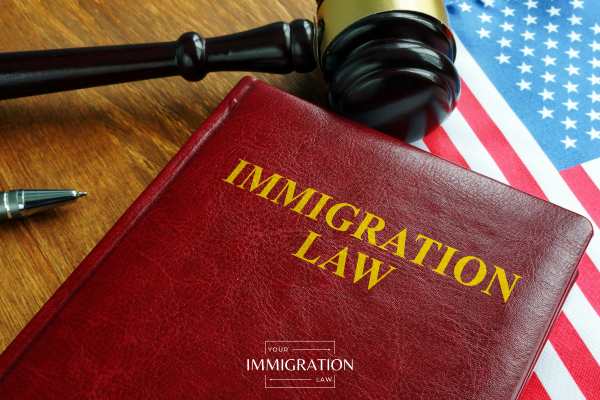 a gavel, US flag, and passport on a table