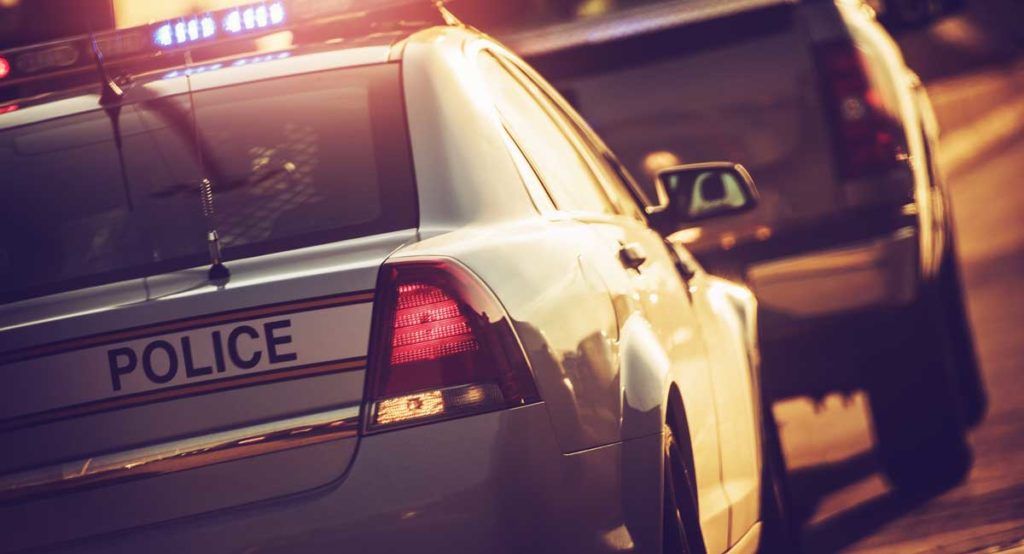 car getting pulled over by a cop car - DUI case