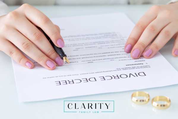 a woman filling out a Michigan decree for divorce