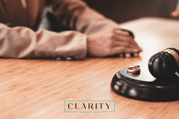 a man meeting with a lawyer to discuss a divorce, uncontested vs. contested divorce