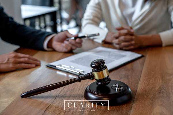a man meeting with a divorce lawyer to discuss how much it will cost