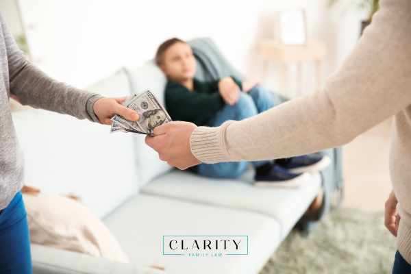 a man giving his ex wife a child support payment