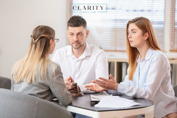 a couple meeting with a divorce mediator