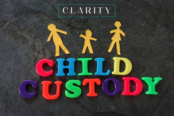 a family paper cutout above the words child custody